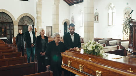 Funeral,-church-and-people-with-hand-on-coffin