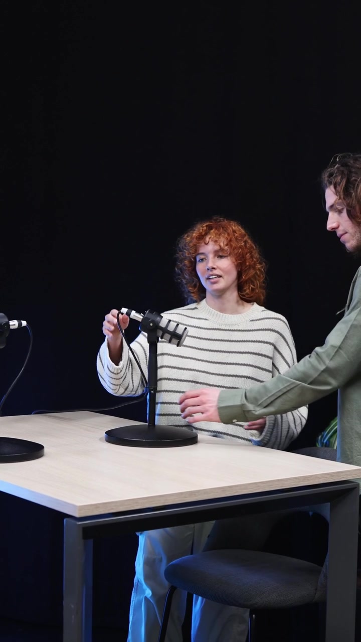 Young Woman and Man Preparing for a Podcast Recording