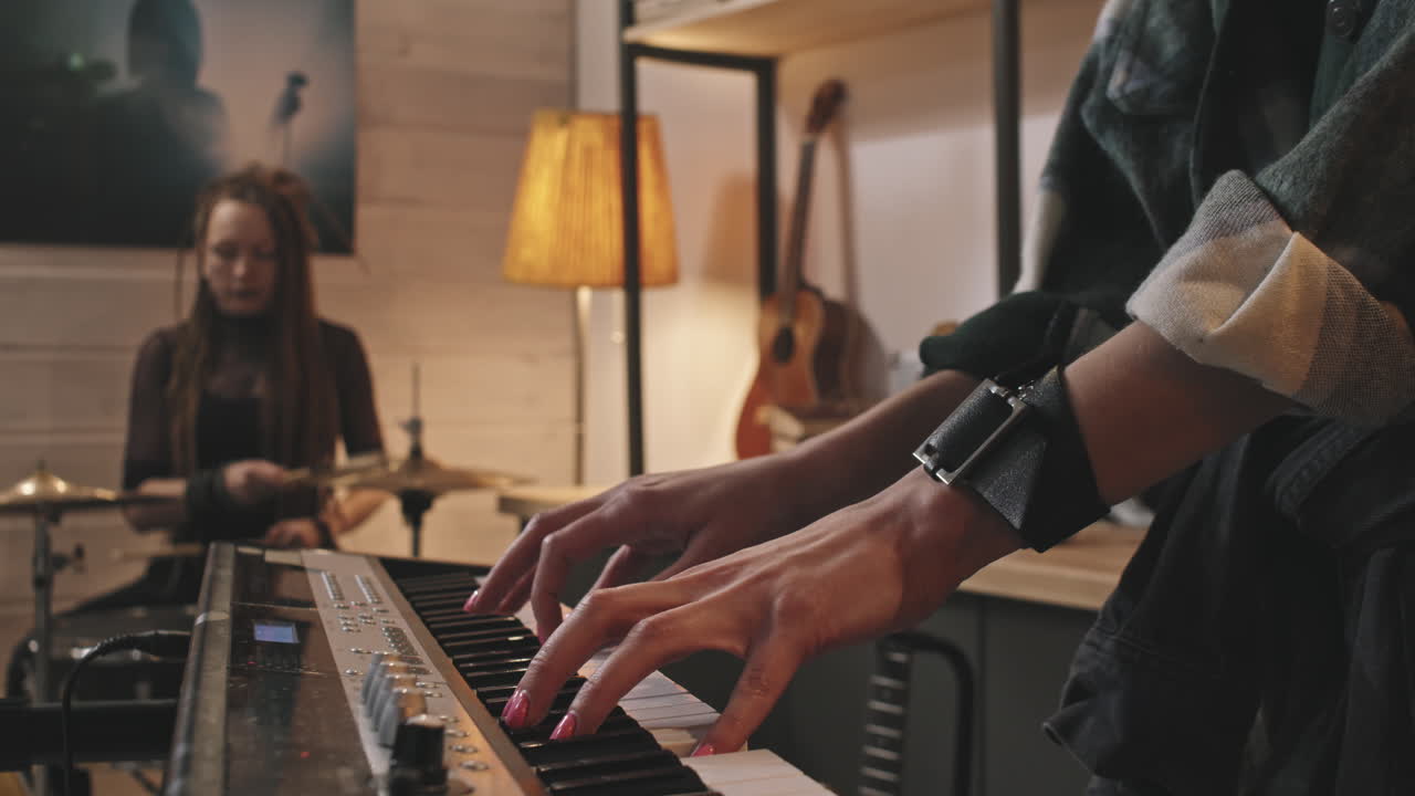 Female Pianist And Drummer Playing Music