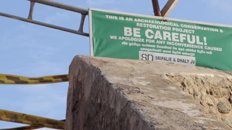 concrete stairs with nobody in galle fort panning upwards to a be careful warning sign with yellow keep out tape b roll clip