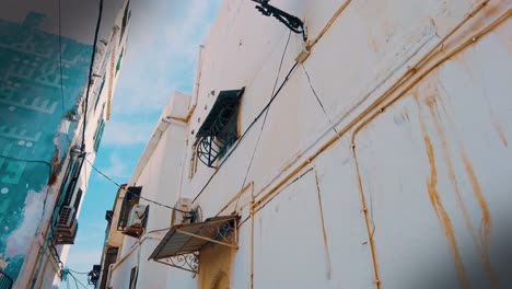 very-beautiful-alley-between-the-houses-of-the-casbah-of-Algiers-in-a-sunny-day-with-a-blue-sky