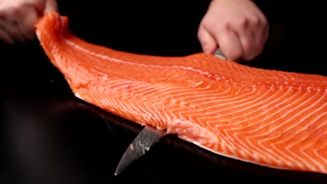 chef cutting fresh salmon