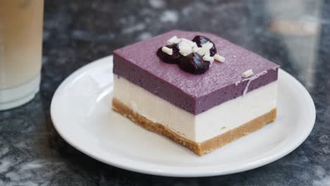 closeup of a blueberry cheesecake on a plate