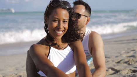 Pretty-black-girl-with-boyfriend-on-beach