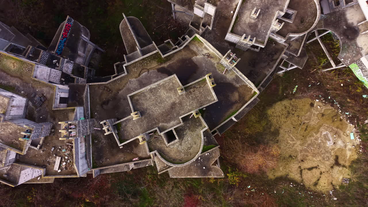 Exploring the eerie beauty of an abandoned structure amidst nature's reclaiming hand