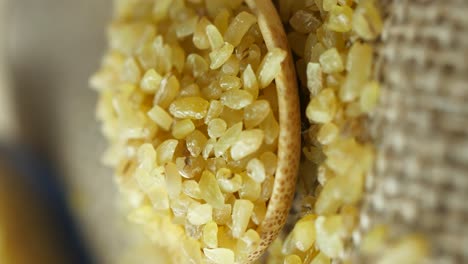 bulgur wheat in a wooden spoon