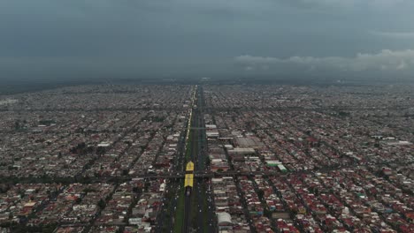 aerial footage captures ecatepec at nightfall on an overcast and wet day