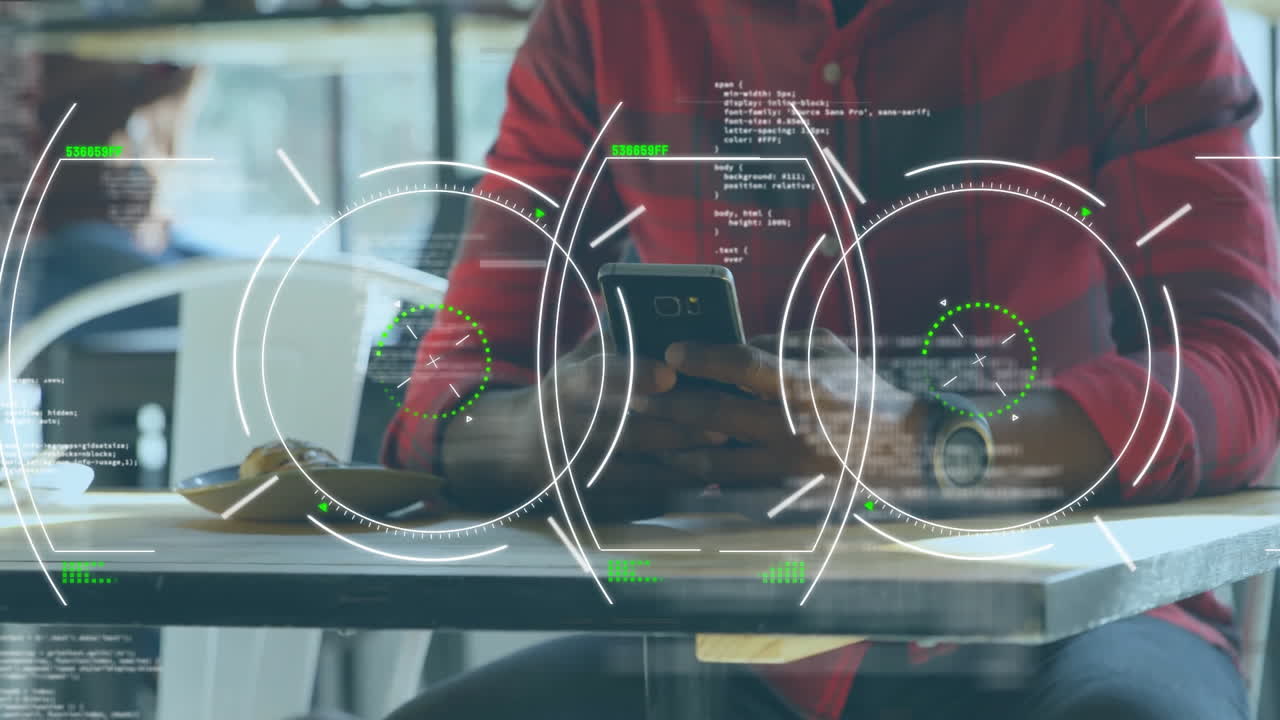 Person using smartphone at cafe with digital data processing animation overlay