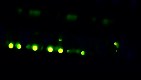 defocused bokeh light of working data server switch rack with internet cable