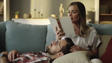 Couple Reading Together on Couch