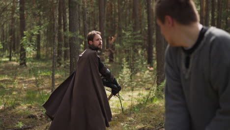 sword fight with knight in forest, reconstruction of battles