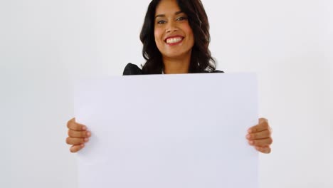 portrait of female business executive holding blank placard 4k