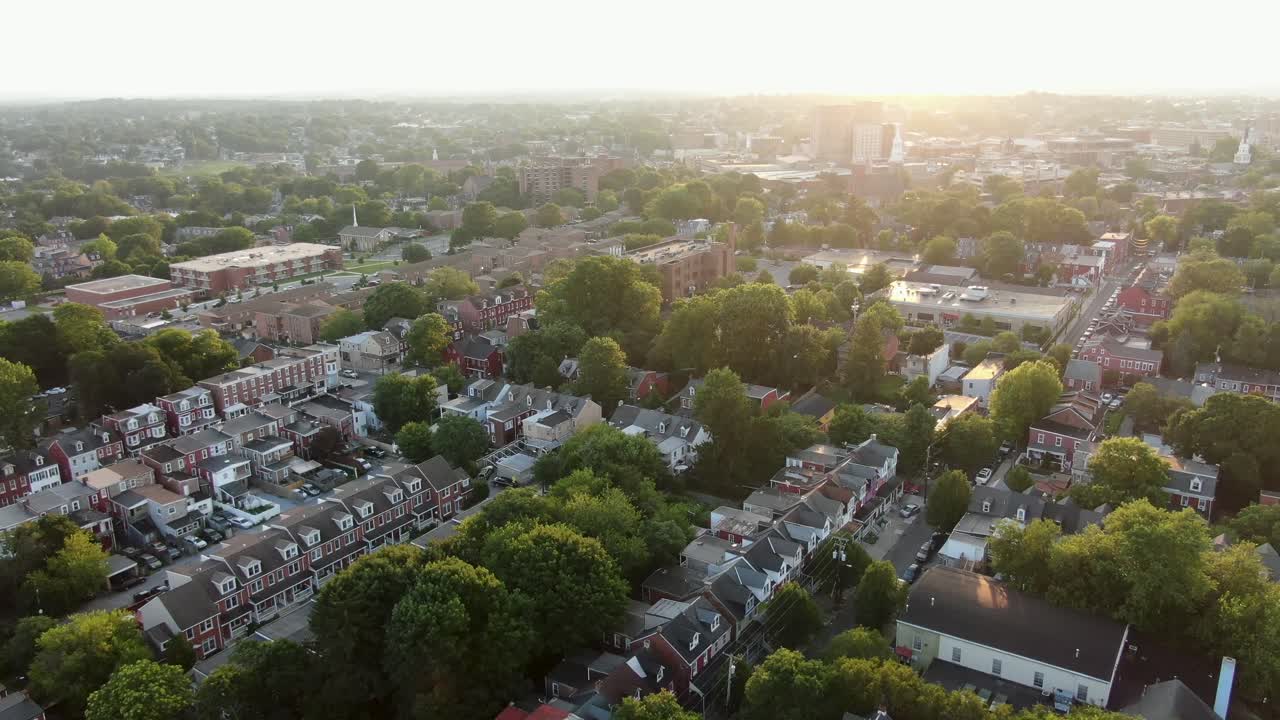 High aerial establishing shot of Lancaster City, Pennsylvania PA USA during summer sunset