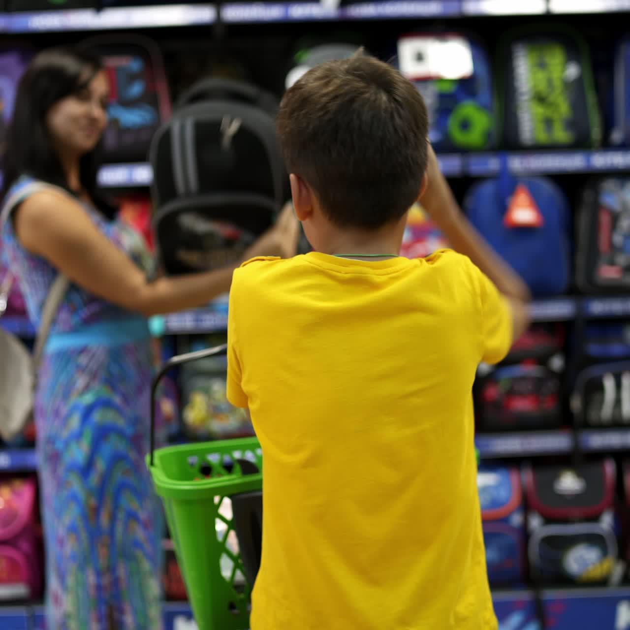 Boy choosing backpack