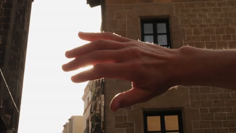 travel freedom a concept, close up of traveler man hands closeing sun shine with sunrise in summer, sunset