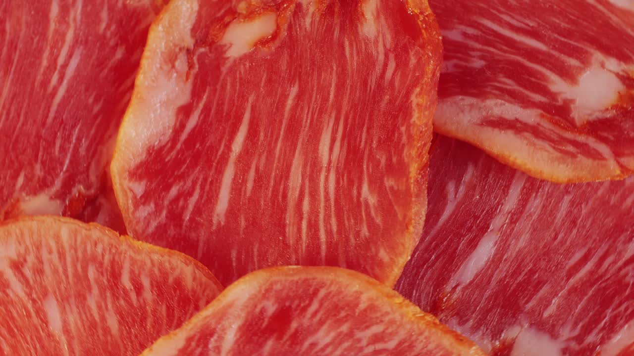 Mix of spanish pork sausages, Cutting board of appetizing catalonian snack - fuet, jamon, chorizo, olives, supermarket tapas food in spain, traditional cuisine.