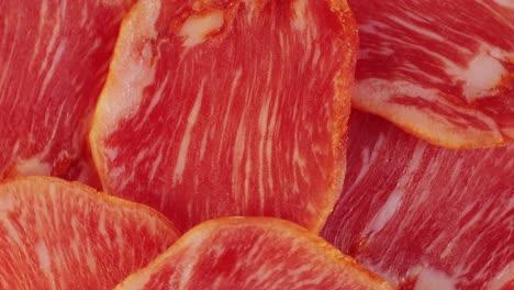 mix of spanish pork sausages, cutting board of appetizing catalonian snack - fuet, jamon, chorizo, olives, supermarket tapas food in spain, traditional cuisine.