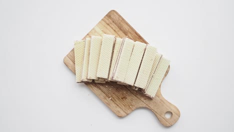 chocolate wafer biscuits on a wooden cutting board