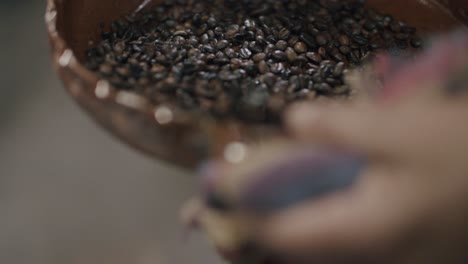 Slow-motion-footage-of-hot-and-freshly-roasted-coffee-beans-being-shifted-about-in-a-bowl-in-Guatemala