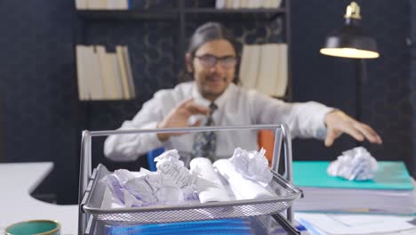 lazy office worker sitting at desk and busy with other things instead of working.