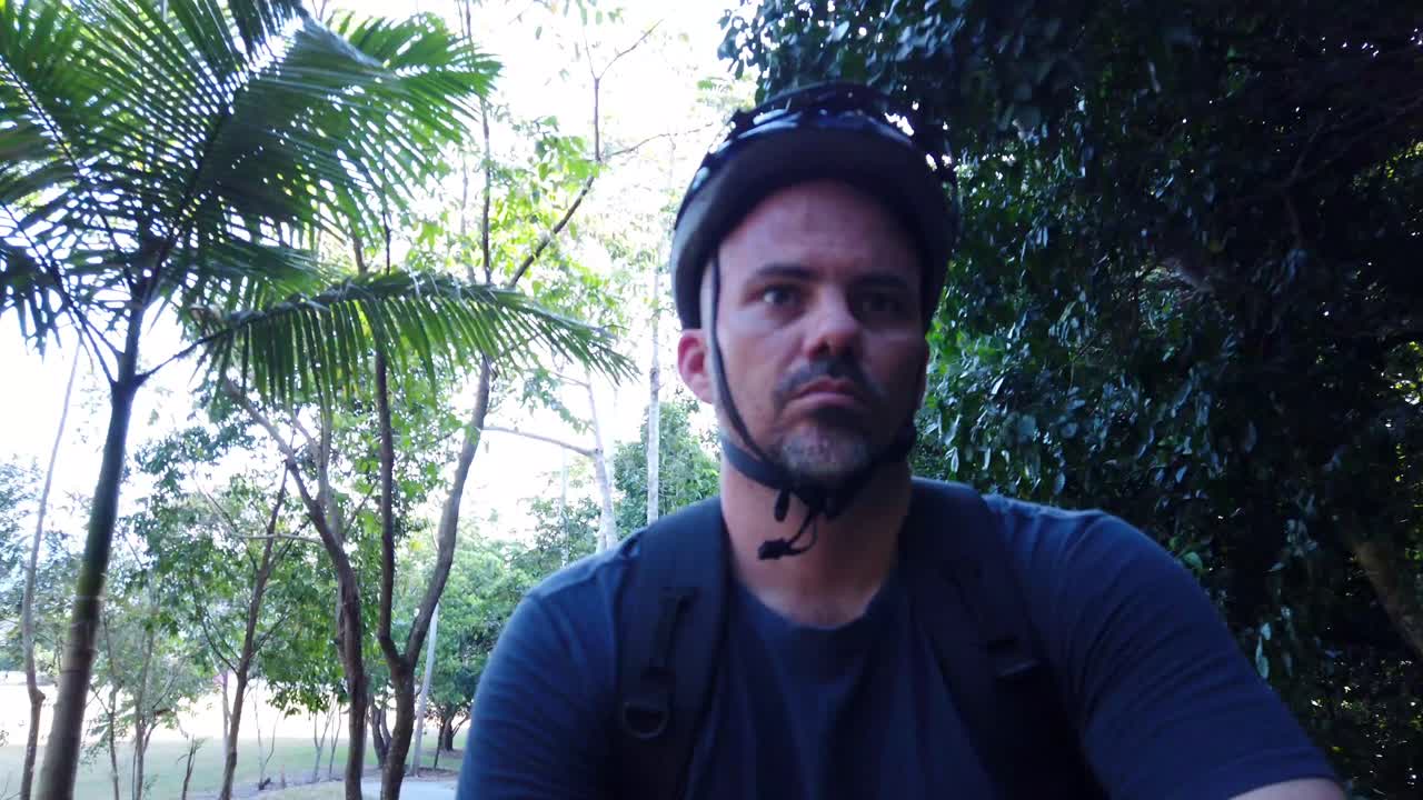 guy riding a bike in close up on a footpath