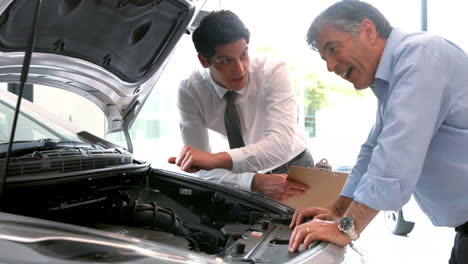 businessman explaining the car details