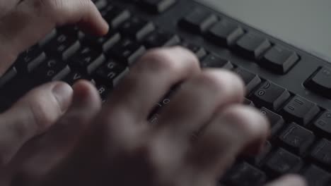 hands typing on a keyboard