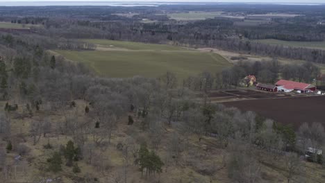 Aerial-view-drone-flight-winter-landscape-forest-in-Kinnekulle-Sweden