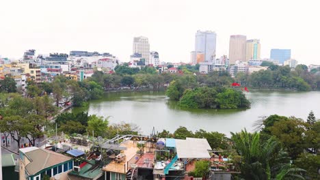 aerial view of pond and cityscape in hanoi