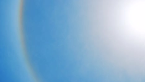 Scenic-View-Of-Beautiful-Halo-Around-The-Sun-In-The-Bright-Blue-Sky---medium-shot