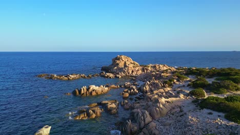 coastline of rock formations, clear ocean water and blue sky