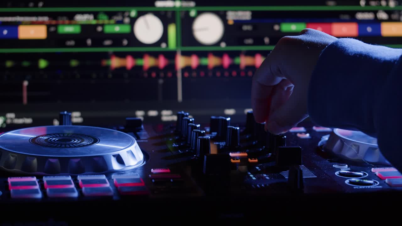 DJ with headphones and sunglasses playing music on festival in night club. Techno musician performing at nightclub for concert crowd of people, city bar.