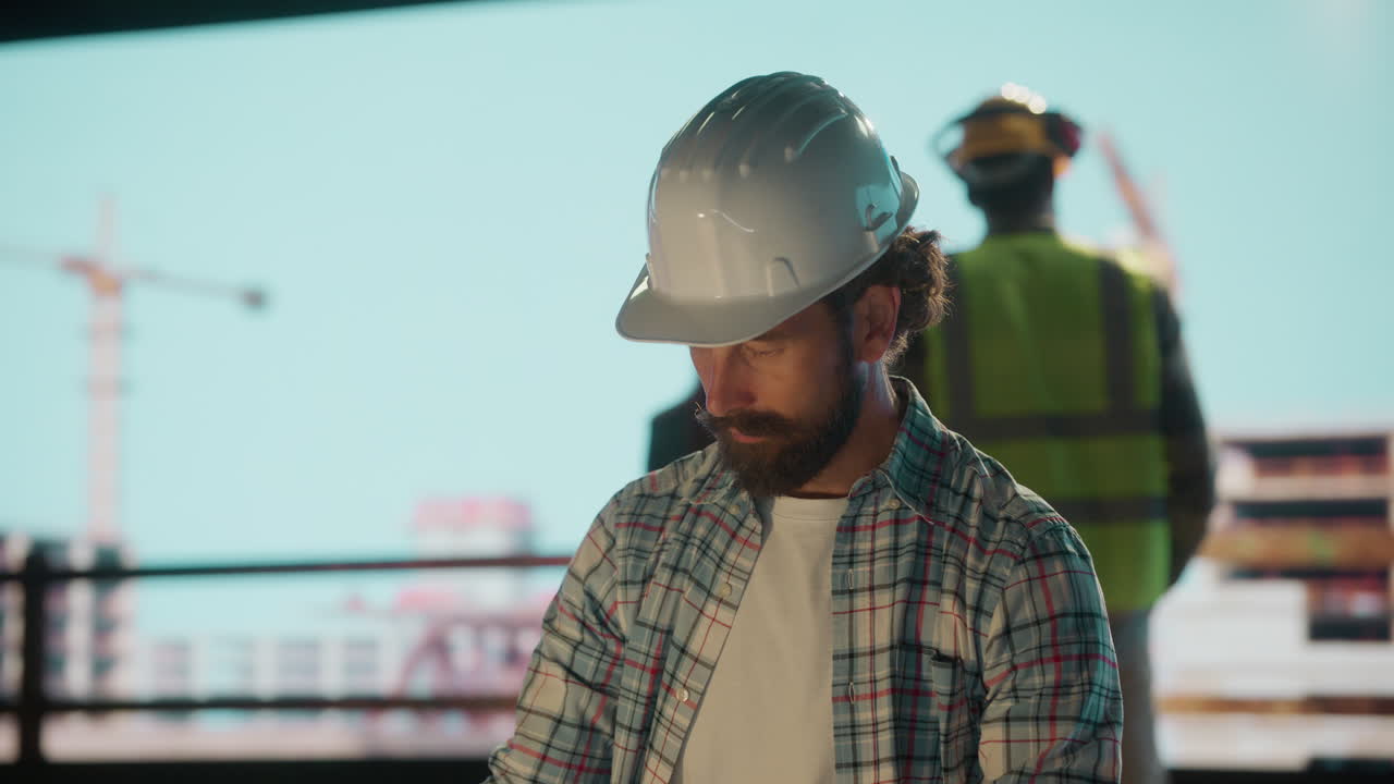 Professional Engineer on a Construction Site with Colleagues