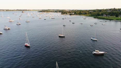 Sailboats-in-bay-docked-in-Jamestown-Rhode-Island-during-golden-hour