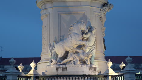 lisbon, commerce square, king jose's statue's base details zooming in during dusk