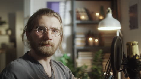 portrait of man at home recording studio