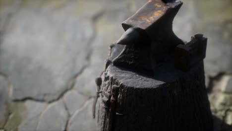 old anvil attached to a stump