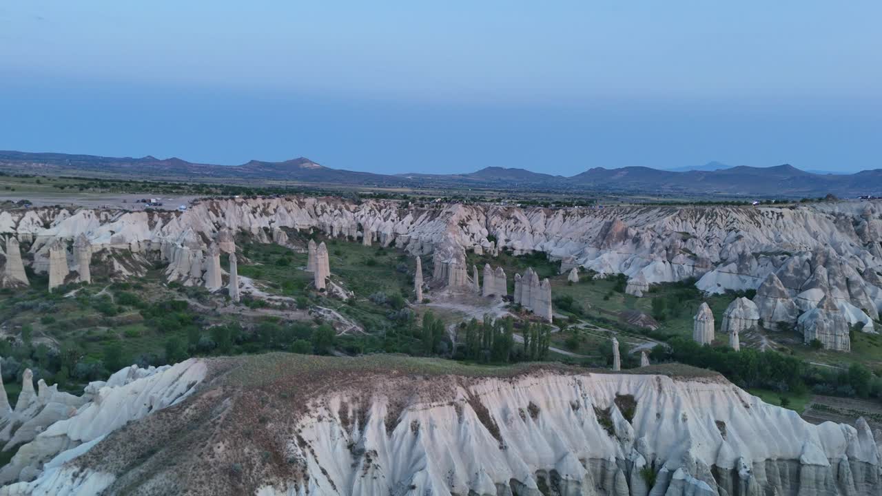 Cappadocia's stunning rock formations at twilight create a serene landscape