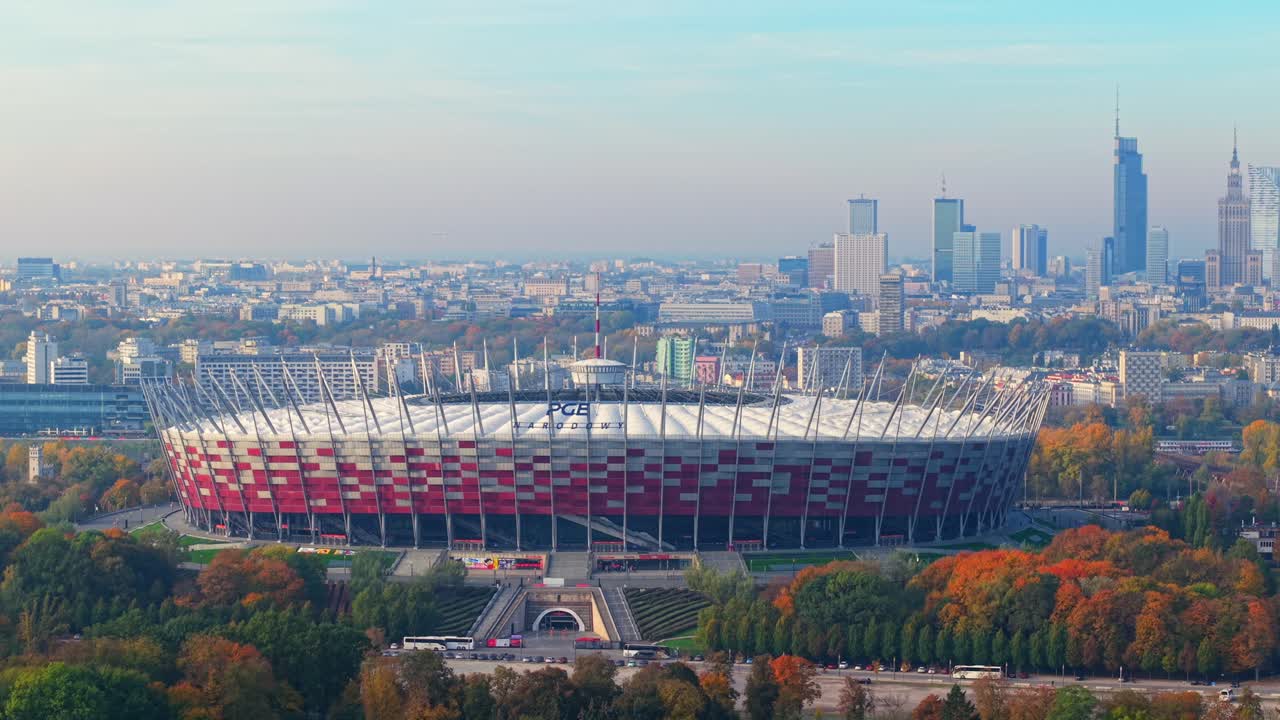 Warsaw, Poland. Aerial View of PGE Narodowy, National Football Stadium and Modern Tower Buildings in Misty Skyline