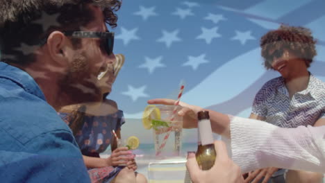 animation of waving flag of usa over group of friend having fun on the beach