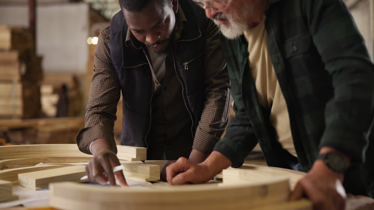 Woodworkers collaborating on a project