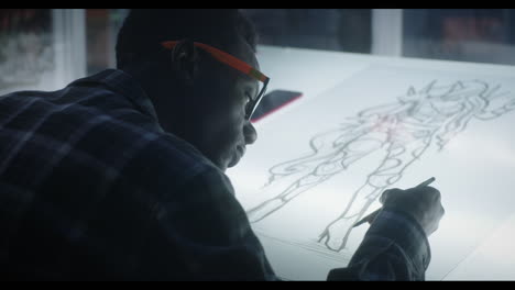 man drawing a figure