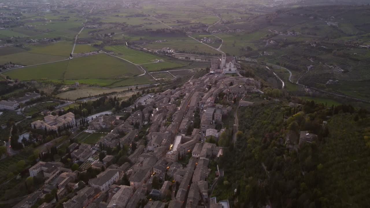 Aerial view of Assisi's town, Umbria, Italy high angle, sunset, 4k
