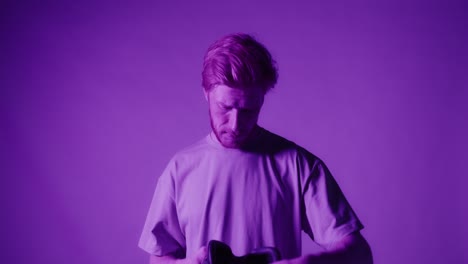 man wearing vr headset in purple light
