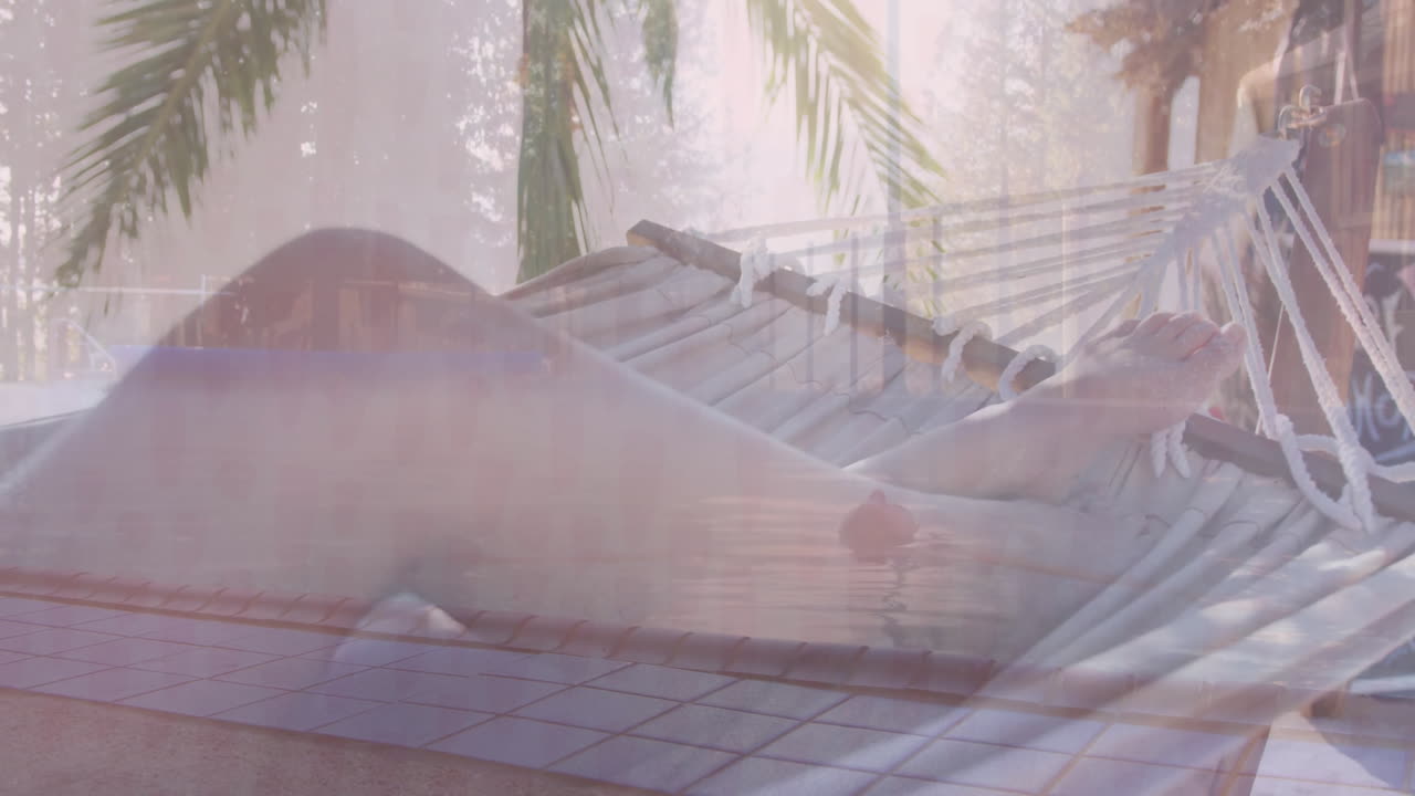 Two women relaxing on rope hammock outdoors, displaying animated heart icon and health chart