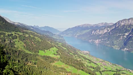 cinematic aerial establishing shot of lake walensee in verdant valley