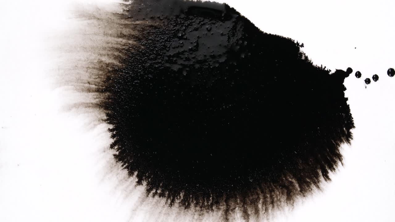 Black Ink Drops On White Background