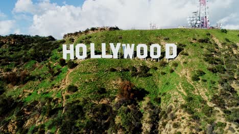 hollywood sign, iconic symbol surrounded by california hills, close aerial view