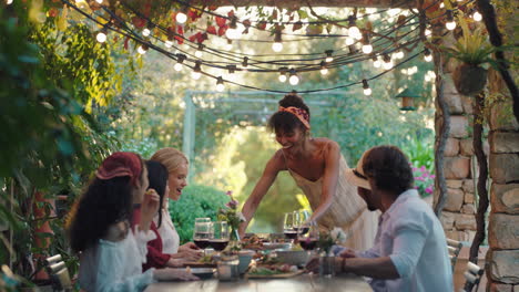 friends making toast celebrating dinner party drinking wine eating mediterranean food sitting at table enjoying beautiful summer day outdoors 4k footage