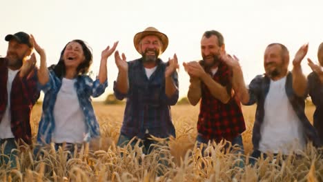 joyful celebration among friends in a wheat field: a heartwarming display of happiness, unity, and agricultural abundance captured in the moment